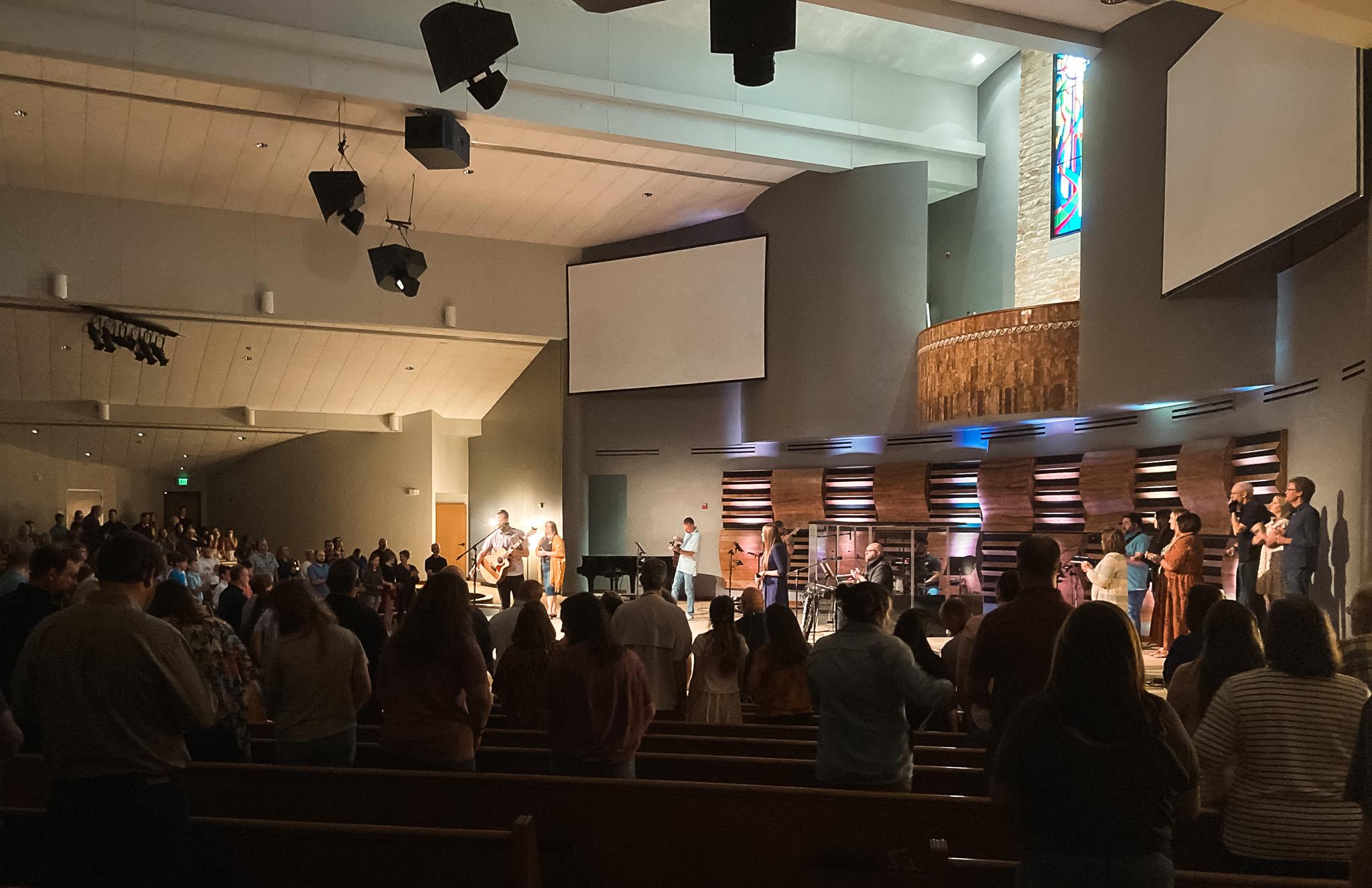 Matt Bennett and the Worship Team on stage with a new PA system and acoustic paneling from Lucid Audio Video
